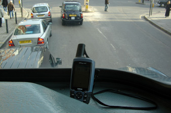 GPS receiver resting on the top deck of the number 4 bus, London